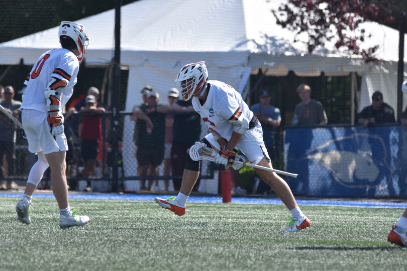 Princeton attack Colin Burns (No. 0) jumps in excitement while his teammate Chad Palumbo lets out a defiant yell following a score. The back-and-forth affair featured 37 goals, the most in an NCAA Quarterfinal game ever that didn’t go to overtime.