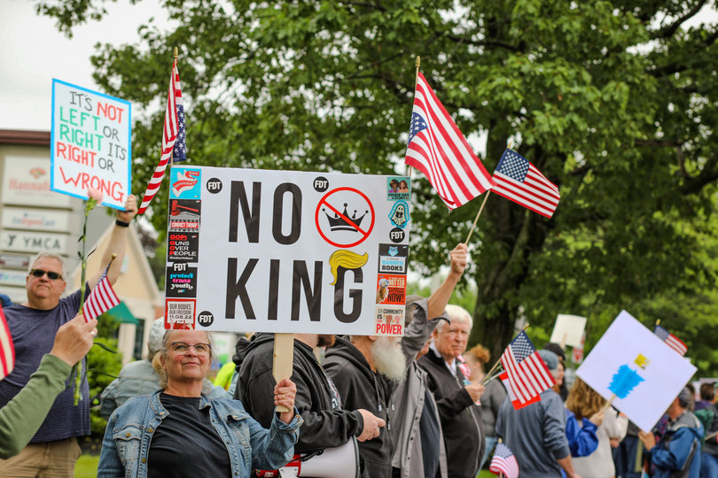 ALBANY, NY — Along with signs, many protesters hold up their U.S. flags – upside down and not. “No Kings” organizers implored demonstrators to bring U.S. flags to show their patriotism.  
