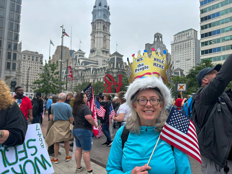 PHILADELPHIA, PA — Cynthia Ruffner poses in JFK Plaza (Love Park) in front of Philadelphia City Hall. Philadelphia hosted the nationally broadcast rally as Washington, D.C. did not host a demonstration to avoid clashes with the Army’s 250th Anniversary Parade.
