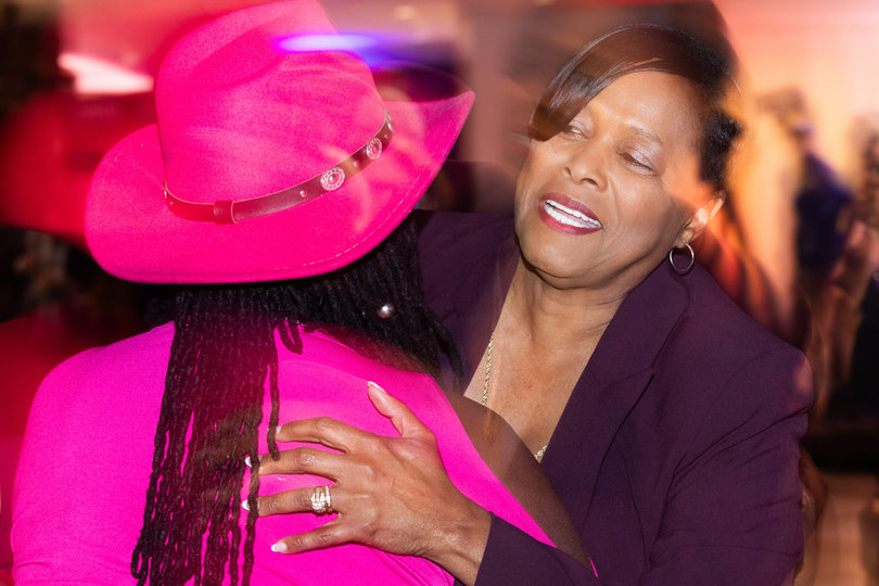Owens hugs an attendee at her watch party. She made rounds and engaged with her guests throughout the night. 