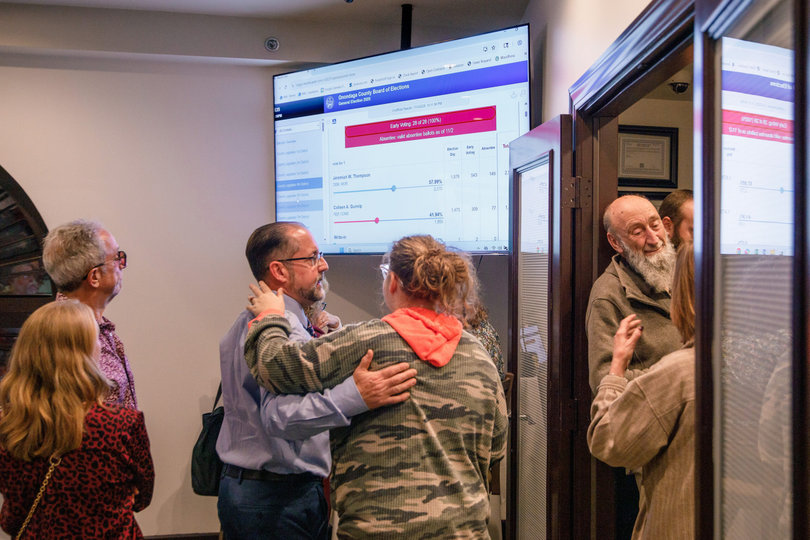 Republican candidate Thomas Babilon embraces his daughter as poll results emerge. Surrounded by his supporters, other Republican candidates and colleagues, Babilon celebrated his campaign journey at his Tuesday night watch party. 

