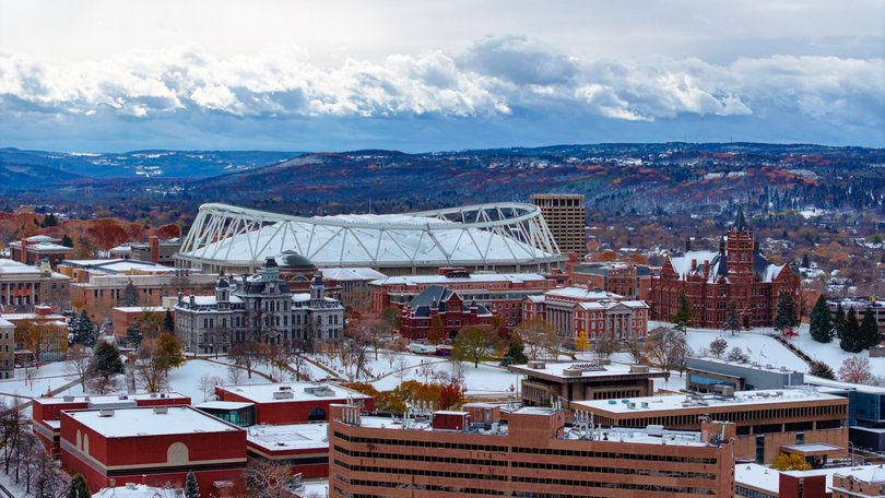 A blanket of snow covers Syracuse University’s campus as it experiences the first snowfall of the school year. The first flakes arrived on Monday, with more accumulating on Tuesday.  
