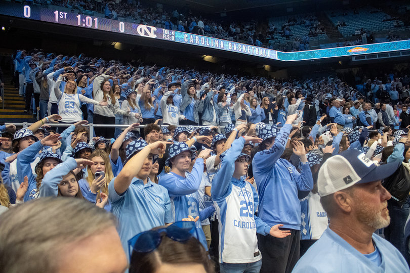 North Carolina’s student section in the Dean E. Smith Center poses about a minute before the Tar Heels hosted Syracuse. UNC’s student newspaper, The Daily Tar Heel, recently ran an advertisement advocating against the university’s potential relocation of the arena.