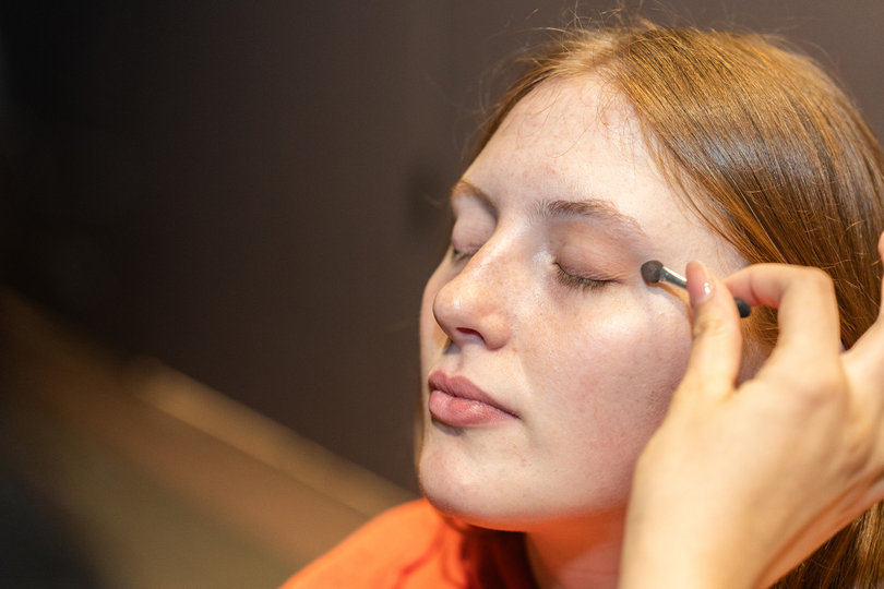 Ahead of the show, models got the hair and makeup done by SU students. 