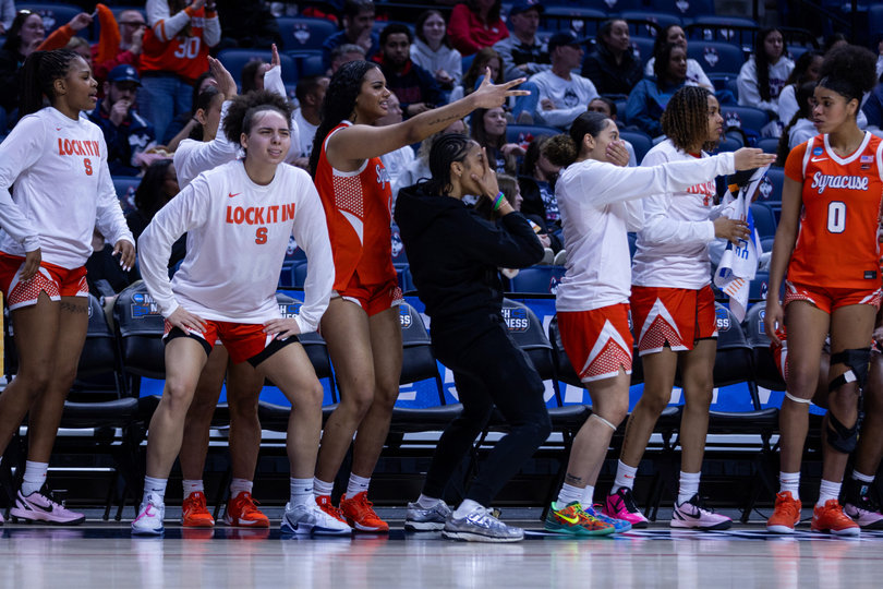 Syracuse’s bench celebrates a 3-pointer in the Orange’s win over Iowa State. SU went 9-of-25 on 3-pointers, which eventually made the difference in the nine-point win.
