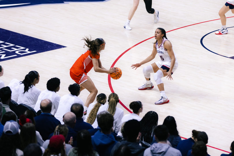 Syracuse guard Laila Phelia makes a move on UConn guard Azzi Fudd in SU’s second-round loss to the Huskies. Phelia scored 10 points in her final game of the season, finishing the year averaging 13.7 points per game. 
