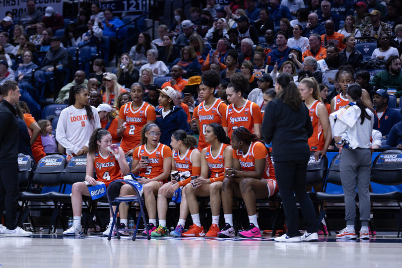 Syracuse players congregate on the bench during a timeout in SU’s loss to UConn Monday. The Orange’s 53-point defeat was their worst under fourth-year head coach Felisha Legette-Jack.