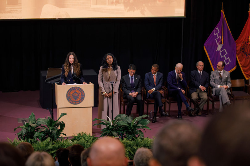 Emery Bielecki, president of the College of Law’s Student Bar Association, introduces Biden before his remarks. Kayzjah Charles, the School of Law’s class of 2026 president, spoke alongside Bielecki as the student representatives during the ceremony.