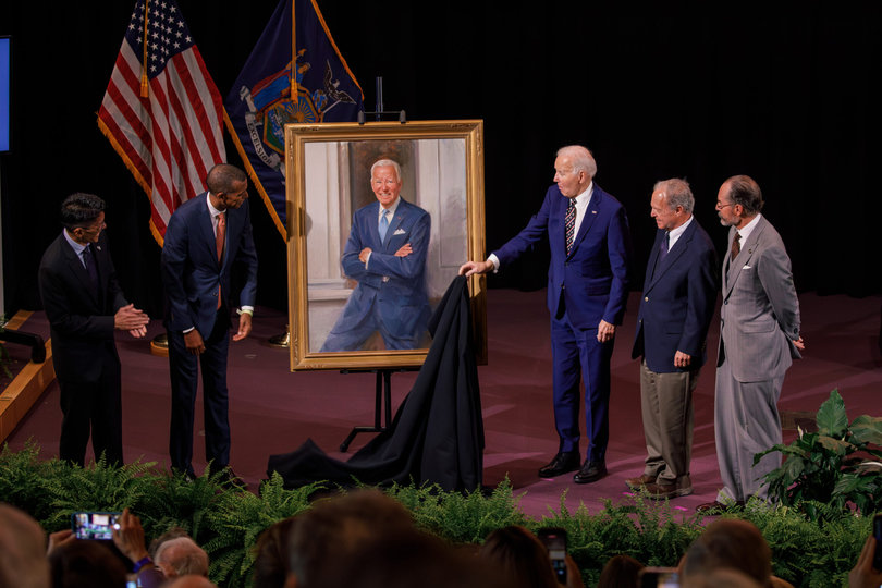 From left to right, Syracuse University’s School of Law Dean Terence Lau, Board Chairman, Jeffrey M. Scruggs, President Joseph R. Biden Jr., Biden’s former classmate Bill Brodsky and artist Michael Shane Neal reveal Biden’s newly commissioned portrait. The reveal took place Tuesday afternoon in the Melanie Gray Ceremonial Courtroom in Dineen Hall.