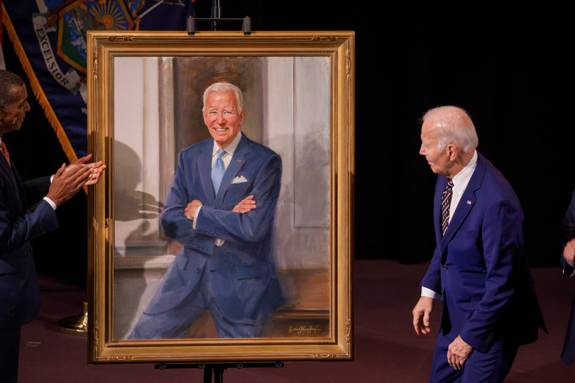 Biden examines his portrait, painted by Neal, whose art hangs in the National Portrait Gallery. During his remarks, Neal said he hoped to portray the president’s openness as a leader as well as his courage and determination.