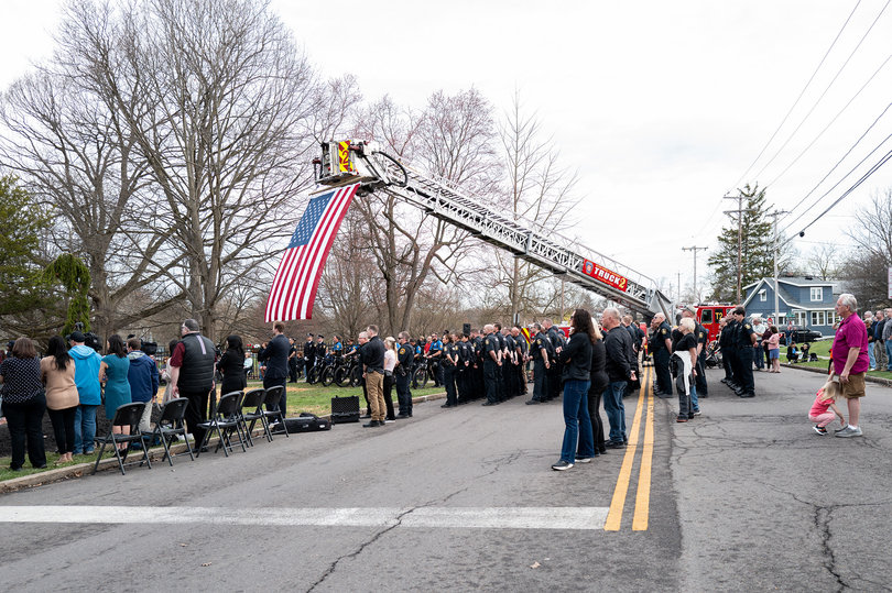 The Syracuse Fire Department Station Truck 2 stands alongside officers and attendees during Tuesday’s unveiling. The ceremony took place at the statues’ permanent location at James Pass Arboretum, a city park in the South Side of Syracuse.
