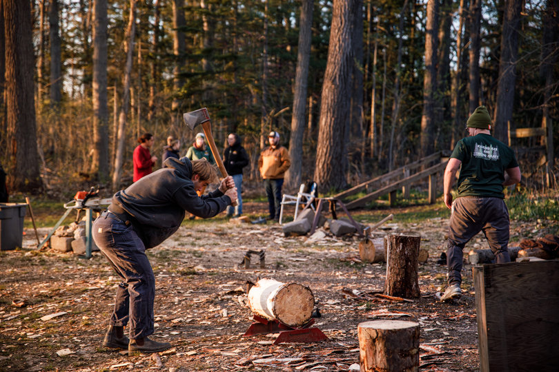 James Dziergas uses a backwards ax to hammer a log into its stanchion. The log will be marked with crayon used for underhand chop, when a competitor cuts two converging wedges.