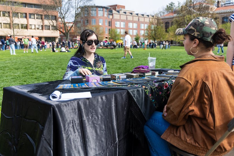 A psychic gives a student a free tarot card reading during SoundCheck. Participants also enjoyed free University Union merch, music from student performers and food from food trucks.
