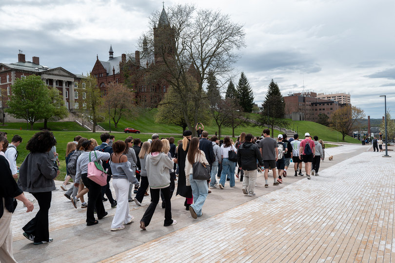 Supporters begin their short trek on the Einhorn Family Walk in solidarity with the outgoing chancellor. A majority of the group donned gray clothing, the official color of brain cancer and tumor awareness.
