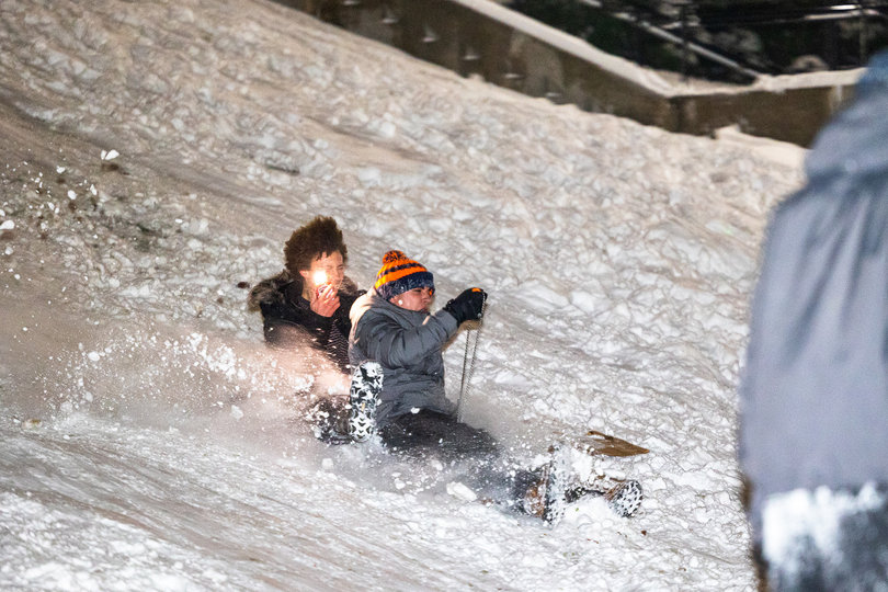 December 3, 2025: Students sled down the hill near Crouse College. This is one of the many ways students bear Syracuse winters.