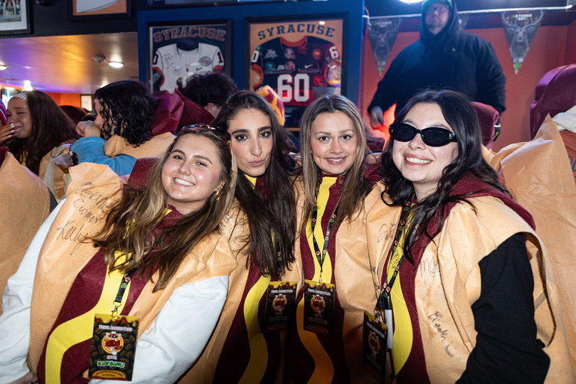 February 7, 2026: Participants at The Hot Dog Hop bar crawl that stopped in Syracuse in February. The hot dog suits came with the purchase of a ticket.