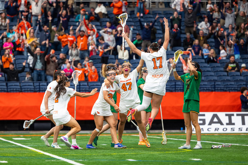 April 11, 2026: Syracuse women’s lacrosse players rejoice after the Orange’s quadruple-overtime win over Notre Dame. The 10-9 victory was SU’s longest in program history and extended its winning streak to 12 games.