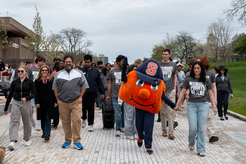 April 28, 2026: Current and former Student Government Association executives, alongside Otto the Orange, lead a walk in support of outgoing Chancellor Kent Syverud’s recent brain cancer diagnosis. Student organizations represented their respective groups, with over 60 organizations appearing throughout the crowd.
