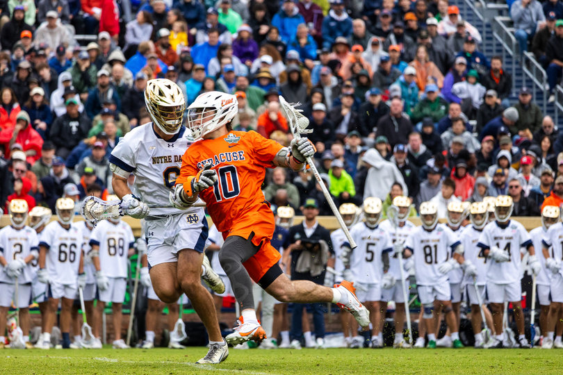SU midfielder Matt McIntee tries to weave past ND midfielder Fisher Finley. McIntee was held pointless while Finley scooped up two ground balls and caused a turnover.