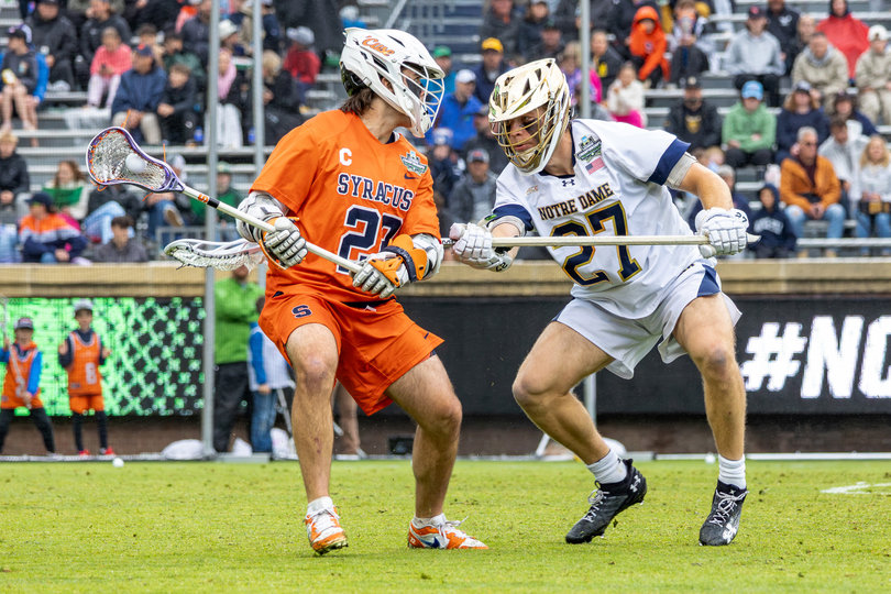Spallina pulls his stick back while being defended by ND’s Nate Schwitzenberg. Spallina’s decorated Syracuse career, which includes the program’s all-time points and assists record, ended Saturday without scoring a goal.