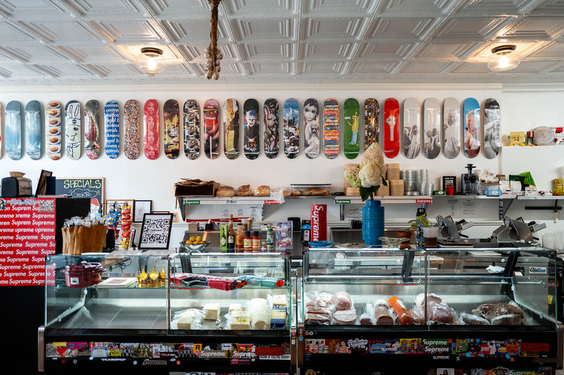 Skateboards line the wall above Dell Street Deli's display case. Located in the Westcott neighborhood, the deli uses locally sourced ingredients.