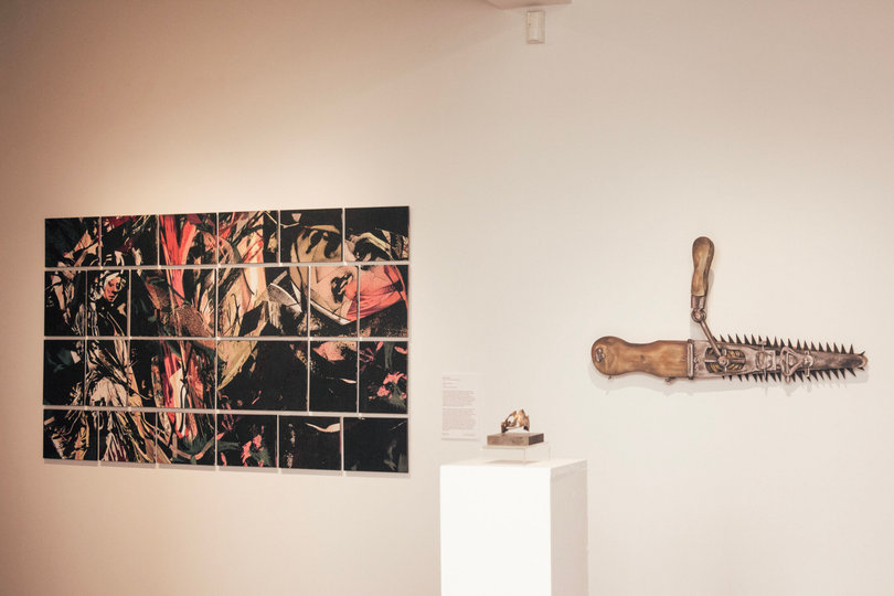 Hayley Peisher, an MFA student in the College of Visual and Performing Arts, created a wooden sculpture of a chainsaw. The piece, which is a replica of historic chainsaws used for cesarean sections, represents medical negligence toward female patients.