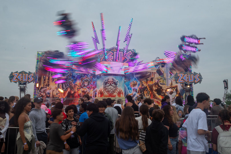 As the day ends, young attendees wait in excitement for the Zeus ride. Since Sept. 29, the fair has been packed every single day.