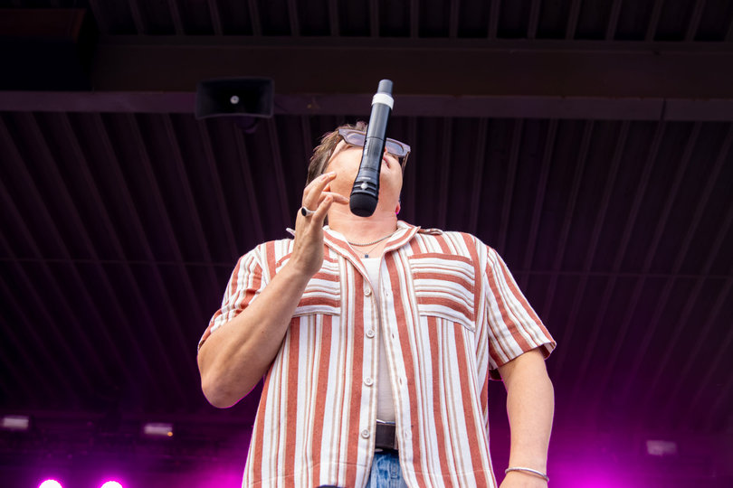 Musician Jesse McCartney flips his microphone midair during his performance during the Great New York State Fair. McCartney performed in front of 6,700 fans in Chevy Court.