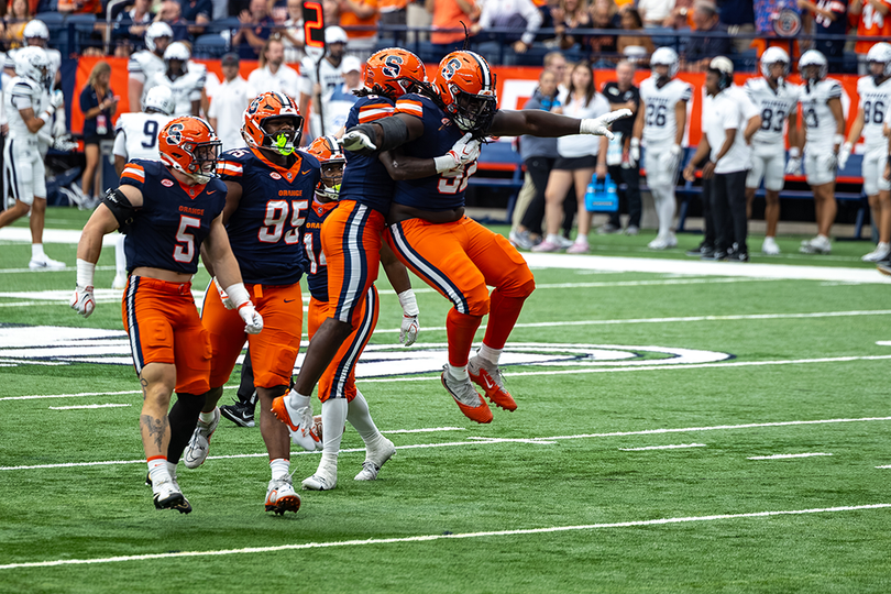 Syracuse defensive tackle Rashard Perry celebrates during SU's 66-3 win over New Hampshire Sept. 5. Perry had an interception in the game, one of four takeaways for the Orange defense.