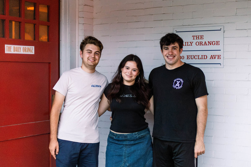Noah Nussbaum, Delia Sara Rangel and Quinn Postman outside The Daily Orange. 