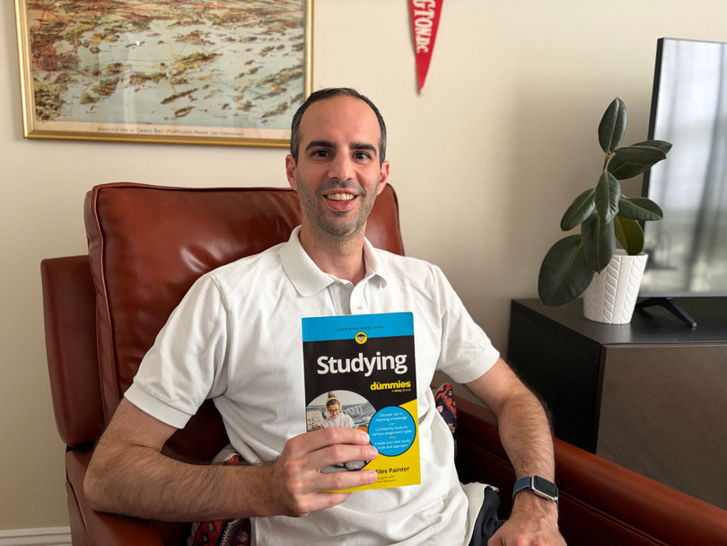Miles Painter holds his book, “Studying For Dummies,” which he spent four years writing. Published June 16, the book details study techniques Painter has used himself alongside established methods.