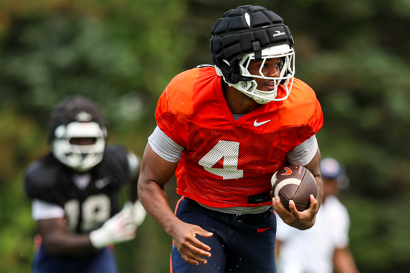 Syracuse running back Ju’Juan Johnson takes a handoff in SU fall practice. Johnson transferred from LSU this offseason, and he's set to play a major role in Syracuse’s running back room.