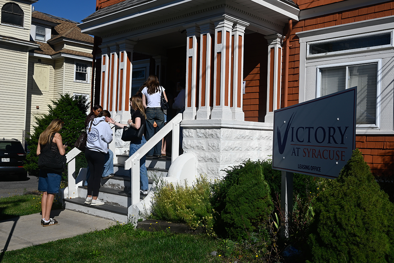 Eager Syracuse University students line up outside Victory at Syracuse's leasing office in hopes of signing a lease. Some students started waiting during the wee hours of the morning.