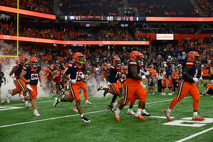 Syracuse football runs onto the JMA Wireless Dome turf before its season-opening win over New Hampshire on Sept. 5. After defeating the Wildcats 66-3, SU hosts Cal Saturday.