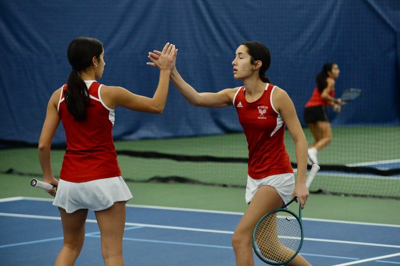 Mira Nadzan (right) and her sister Sonia Nadzan (left) celebrate during a match for Baldwinsville High School. The two have led the Bees to a 4-0 start in 2026.