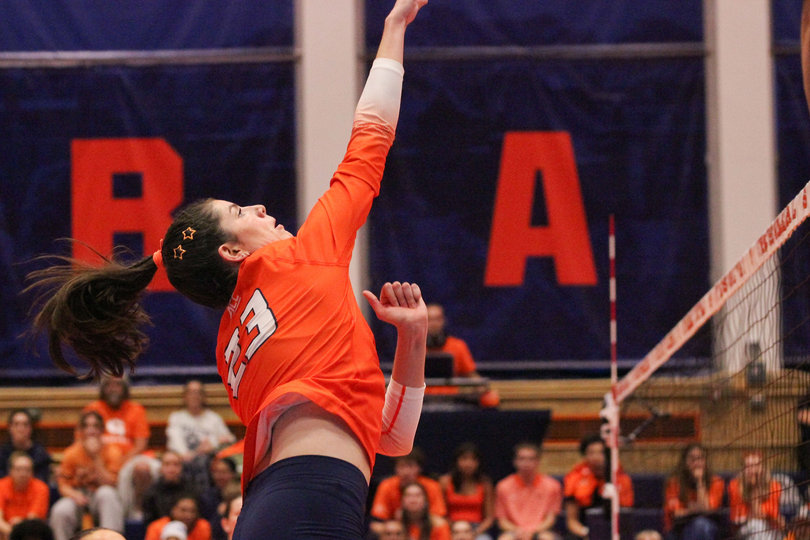 Syracuse middle blocker Abby Nicholson jumps to swat the ball during a 3-0 loss to Arkansas last Wednesday.  The graduate student has totaled 39 kills and a team-high 25 blocks after three years at Lafayette.