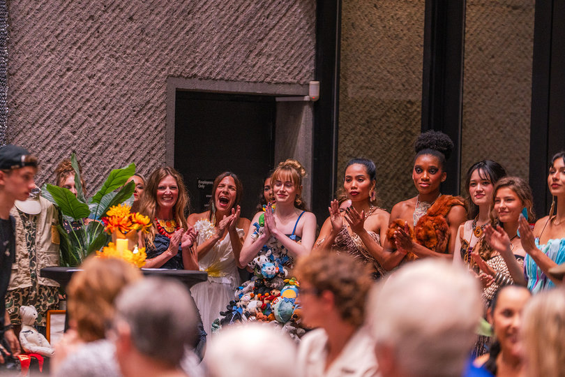 Models wearing designs from Ferrel applaud at the end of the Syracuse Style show. Ferrel is one of 11 designers featured in this year’s show.