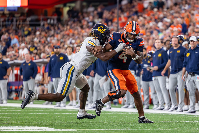 Syracuse running back Ju'Juan Johnson fights off Cal linebacker Kamar Mothudi during Syracuse's 21-18 loss to the Golden Bears on Sept. 12. Johnson is one of four running backs the Orange have used interchangeably through three games.