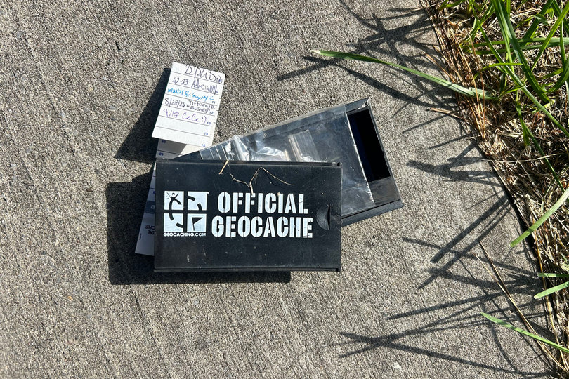 This cache was found on SUNY Upstate Medical University’s campus. The hidden container is part of the game of Geocaching — a real-world treasure hunt where geocachers find and hide caches.