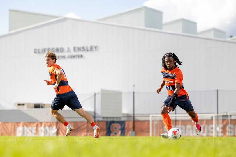 Sachiel Ming (right) and Gabriel Oksanen (left) attack forward in Syracuse's loss to UNH on Aug. 23. The two have been key in SU's 6-3 start through its first nine games.