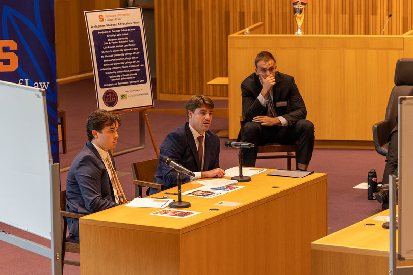 Students from Chapman University's Dale E. Fowler School of Law debate during the Syracuse Name, Image and Likeness negotiation competition. Sixteen teams of two from 12 law schools as far as California competed in the two-day event.