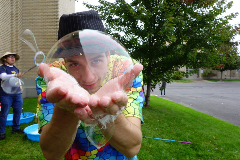 Outside of the Syracuse Vegfest, vegans and vegan-curious onlookers play with bubbles. Nearly 1,000 people gathered for the festival on Sunday at Syracuse’s Science and Industry Building at the New York State Fairgrounds. 