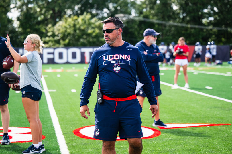 UConn offensive coordinator Nunzio Campanile stands on the team's field. Nunzio was a positional coach at SU from 2023-25, and Saturday will be his first meeting with the Orange since departing.