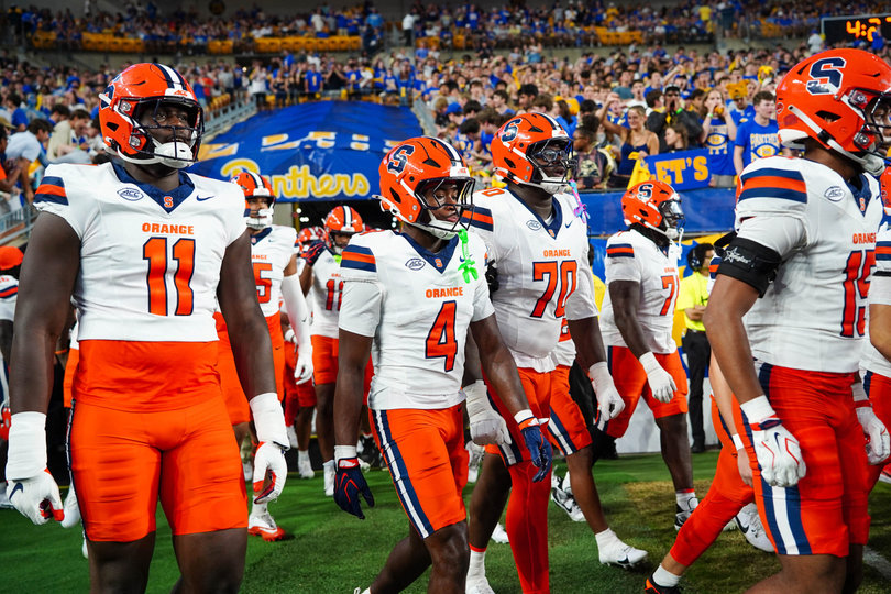 Syracuse football walks onto the Acrisure Stadium field during its loss to Pitt on Sept. 17. After a bye week, SU returns to action Saturday against UConn.